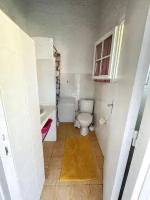 a small bathroom with a toilet and a sink at Charmant studio à Linguizzetta 23 m² avec terrasse privative in Linguizzetta