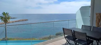 a balcony with a view of the ocean at NEPITA- Vue mer- piscine en résidence de standing- clim-Wifi in Sari Solenzara
