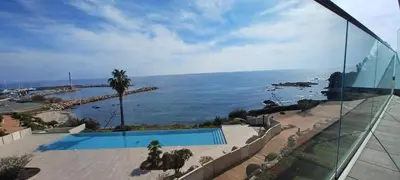 a view of the ocean from a house at NEPITA- Vue mer- piscine en résidence de standing- clim-Wifi in Sari Solenzara