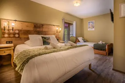 a bedroom with two beds in a room at Auberge U Mulinu in Casalabriva