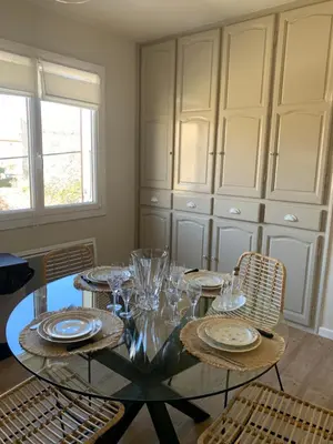 a dining room with a glass table and chairs at A CASA DI MAMMA in Pianottoli-Caldarello