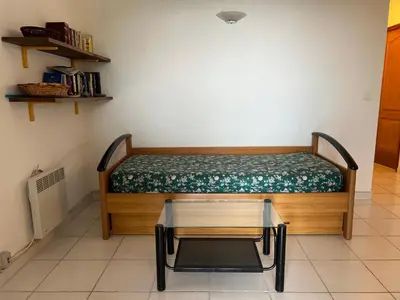 a room with a bed with a table in it at Oro 60 in Conca