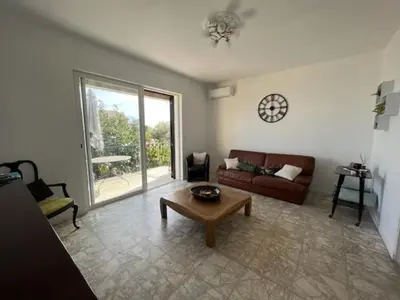 a living room with a couch and a coffee table at A CASA DI LOULOU e MARIA in Furiani