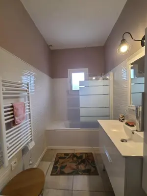 a bathroom with a tub and a sink and a shower at A CASA DI LOULOU e MARIA in Furiani