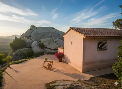 a view of the sun setting over a city and the ocean at mini villa studio 1 pièce 21 m2 pour 2 personnes piscine partagée climatisation in Porto-Vecchio