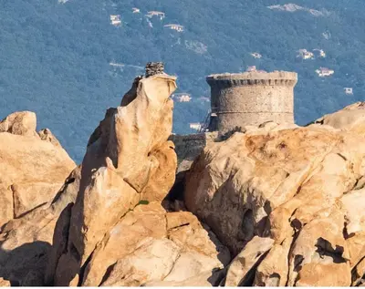 a castle on the top of a mountain at Lavallee in Campomoro
