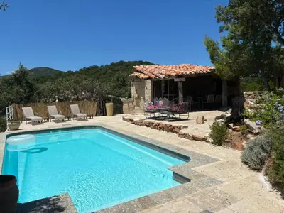 a swimming pool in front of a house at Villa CAROLE Piscine privée Spa Fautéa in Zonza