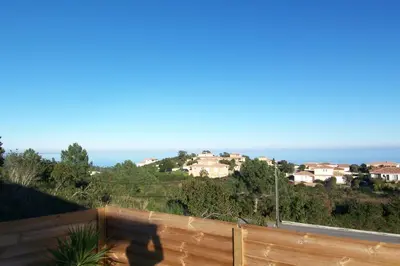 a view of a town from a fence at Clement - Rez de villa - Vue Mer in Sari Solenzara