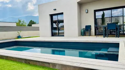 a house with a swimming pool in the yard at VILLA LE CORAIL ROUGE CORSE in Lecci