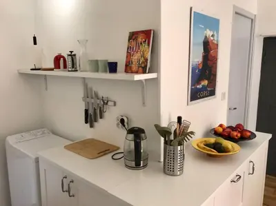 a kitchen with a counter top with a sink at Charmant T3 Centre ville Corté in Corte
