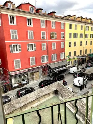 a view of a city street with buildings and cars at Charmant T3 Centre ville Corté in Corte