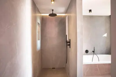 a bathroom with a shower and a tub at VILLA ISULA BELLA in Porto-Vecchio