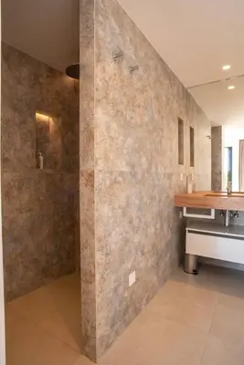 a large bathroom with a shower and a sink at VILLA ISULA BELLA in Porto-Vecchio