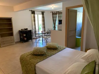 a bedroom with a bed and a table with chairs at A Furtezza in Soveria