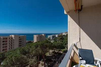 a view of the ocean from the balcony of a building at Chapelle des Grecs - 1km de la plage in Ajaccio