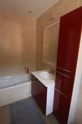 a bathroom with a sink and a bath tub at Ajaccio maison bord de mer dans résidence avec piscine in Ajaccio