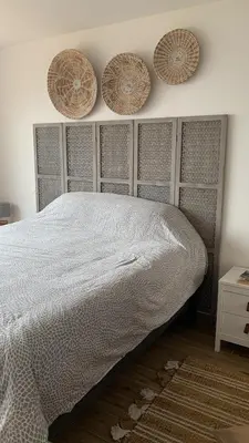 a bedroom with a bed and three baskets on the wall at Ajaccio maison bord de mer dans résidence avec piscine in Ajaccio