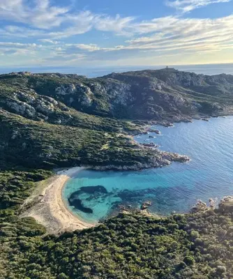 an aerial view of a small island in the ocean at T2 d'exception 100m plage terrasse vue mer et montagnes in Propriano
