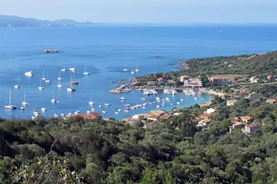 a view of a harbor with boats in the water at T2 d'exception 100m plage terrasse vue mer et montagnes in Propriano