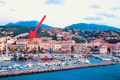 a marina with boats in the water and a city at T2 récent climatisé à 100m du port in Propriano