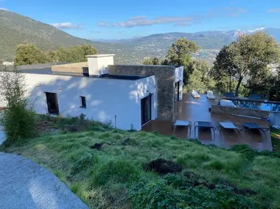 a house in the middle of a river at Villa d'Architecte Casa Mado avec Piscine vue imprenable in Ajaccio
