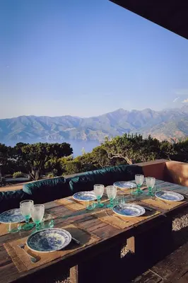 a shelf filled with different types of vases at Corse Piana villa d’architecte vue exceptionnelle in Piana
