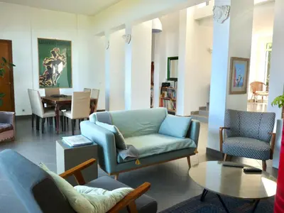 a bedroom with a bunk bed and a door to a patio at Corse Piana villa d’architecte vue exceptionnelle in Piana