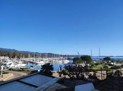 a view of a marina with boats in the water at Appartement sur le port Résidence Marina Palmu in Porto-Vecchio