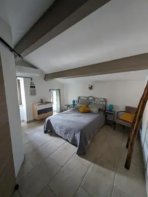 a bedroom with a bed in the middle of a room at Casa di Mela in Mela