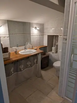 a bathroom with a sink and a toilet at Casa di Mela in Mela