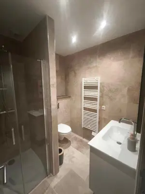 a bathroom with a shower and a sink and a toilet at Casa di Mela in Mela