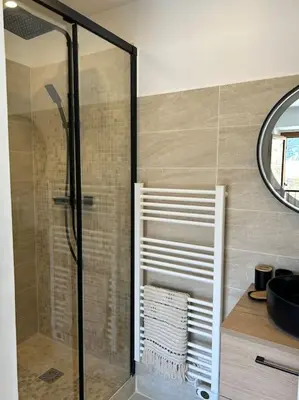 a shower with a glass door in a bathroom at Maison Casa Amarina in Olmeto