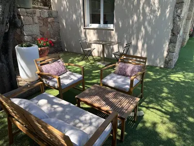 a swimming pool in a yard next to a fence at Chez François et Cécile in Figari