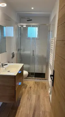 a bathroom with a shower and a sink and a toilet at Chez François et Cécile in Figari