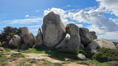 a pile of rocks sitting on top of a field at Chez Baptiste et Laura in Figari