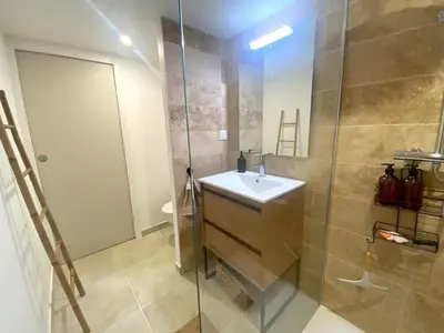 a bathroom with a sink and a shower at Casamea - Vue Mer, Centre Ajaccio, Clim & WiFi in Ajaccio