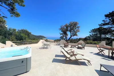 a patio with a pool and chairs and a table at Casa Vecchia Di Olmuccio in Sainte-Lucie de Porto-Vecchio