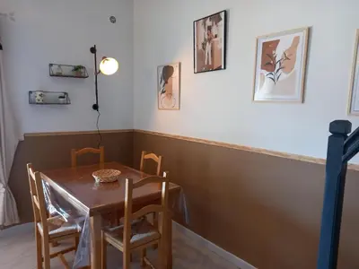 a dining room with a table and chairs at CASA DI PETRU ANTÒ in Serra-di-Ferro