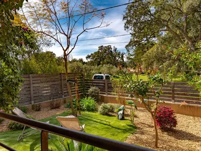 a garden with a fence and a truck in it at Holiday Home Casa Brigitte by Interhome in Sainte-Lucie de Porto-Vecchio