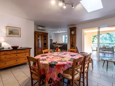 a kitchen and dining room with a table and chairs at Holiday Home Casa Brigitte by Interhome in Sainte-Lucie de Porto-Vecchio