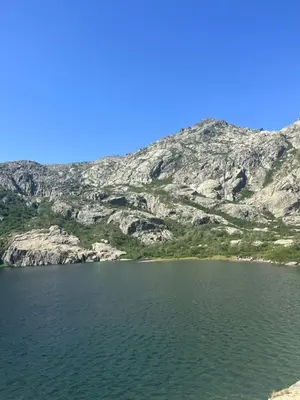 a large lake with a mountain in the background at Résidence Arborea C4 corte in Corte