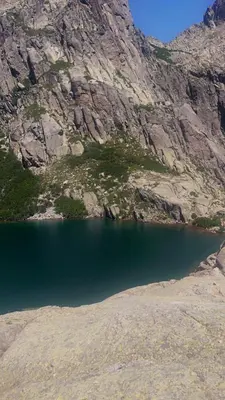 a body of water in front of a mountain at Résidence Arborea C4 corte in Corte