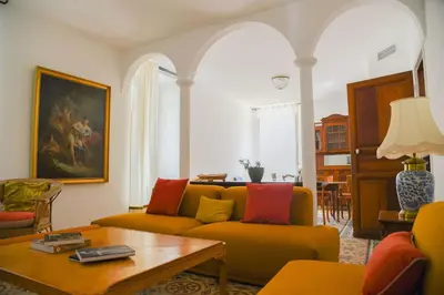a living room with a couch and a table at Casa Maestracci, chambres d'hôtes de charme à Zilia in Zilia