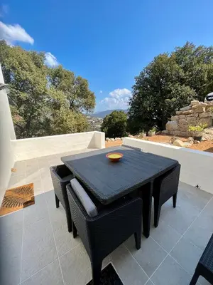 a black table and chairs on a patio at Studio 173 - Ajaccio - Campagne in Ajaccio
