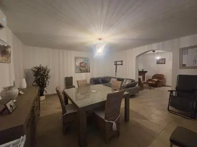 a living room with a couch and chairs and a tv at villa gambotti in Morta
