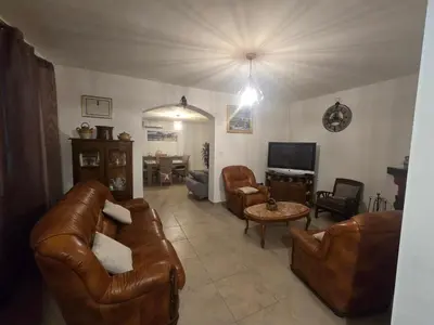 a house with a porch with a table and chairs at villa gambotti in Morta