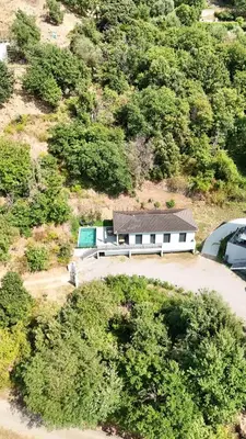 an aerial view of a white house on a hill at A CASA DI LAURENA piscine chauffée proche St Florent in Vallecalle