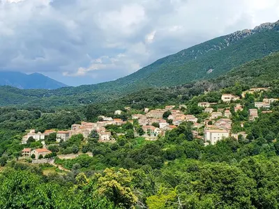 a small town in the middle of a mountain at Studio 2A in Ucciani