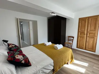 a bedroom with a bed with two towels on it at A COLETTA in Piana