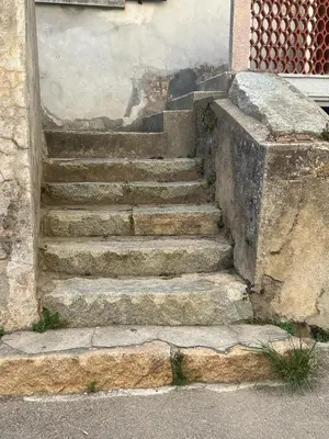 a set of stone stairs in front of a building at A COLETTA in Piana